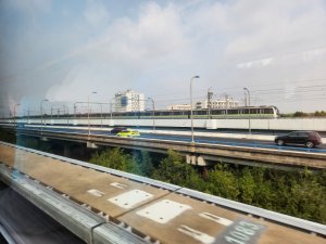 View from MagLev train looking at a conventional train in Shanghai China